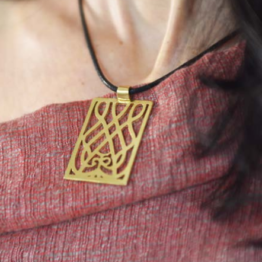 Gold-plated brass pendant, rectangular with sawn-out decoration